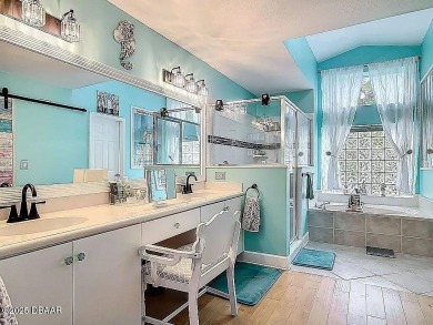 Welcome to this beautifully updated move-in ready pool home in on Plantation Bay Golf and Country Club in Florida - for sale on GolfHomes.com, golf home, golf lot