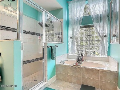 Welcome to this beautifully updated move-in ready pool home in on Plantation Bay Golf and Country Club in Florida - for sale on GolfHomes.com, golf home, golf lot