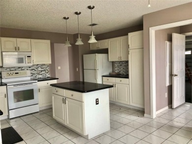 Welcome to this charming 3 bedrooms, 2 bath home in the Villages on Glenview Championship Golf and Country Club in Florida - for sale on GolfHomes.com, golf home, golf lot