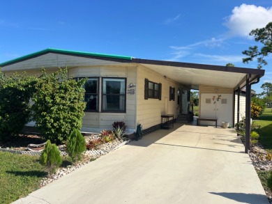 This charming two-bedroom, two-bath home is located in the gated on Lake Fairways Country Club in Florida - for sale on GolfHomes.com, golf home, golf lot