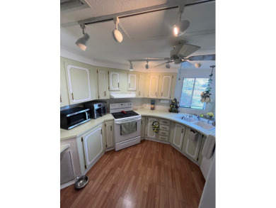 This charming two-bedroom, two-bath home is located in the gated on Lake Fairways Country Club in Florida - for sale on GolfHomes.com, golf home, golf lot