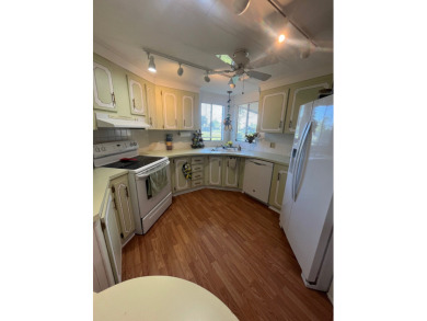 This charming two-bedroom, two-bath home is located in the gated on Lake Fairways Country Club in Florida - for sale on GolfHomes.com, golf home, golf lot