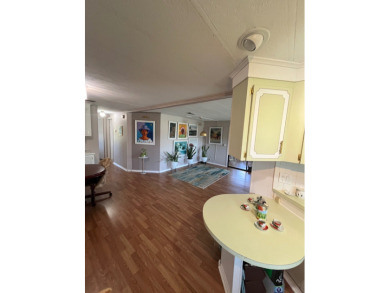 This charming two-bedroom, two-bath home is located in the gated on Lake Fairways Country Club in Florida - for sale on GolfHomes.com, golf home, golf lot