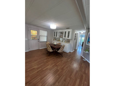 This charming two-bedroom, two-bath home is located in the gated on Lake Fairways Country Club in Florida - for sale on GolfHomes.com, golf home, golf lot