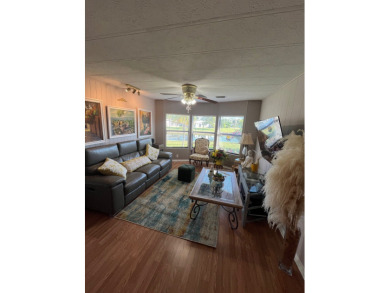 This charming two-bedroom, two-bath home is located in the gated on Lake Fairways Country Club in Florida - for sale on GolfHomes.com, golf home, golf lot