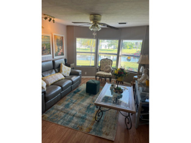This charming two-bedroom, two-bath home is located in the gated on Lake Fairways Country Club in Florida - for sale on GolfHomes.com, golf home, golf lot