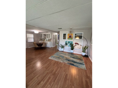 This charming two-bedroom, two-bath home is located in the gated on Lake Fairways Country Club in Florida - for sale on GolfHomes.com, golf home, golf lot