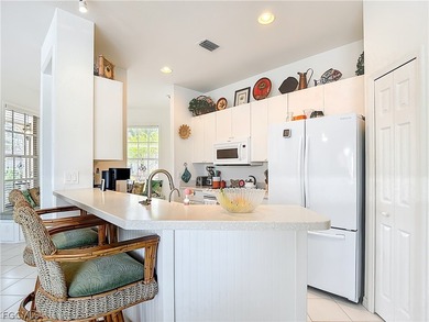 Welcome to this exceptional Ibis II POOL HOME in HERONS GLEN on Herons Glen Golf and Country Club in Florida - for sale on GolfHomes.com, golf home, golf lot