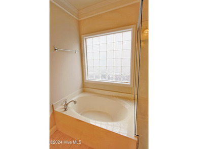 Welcome to your dream home in Cobblestone Village, nestled in on Sea Trail Golf Resort in North Carolina - for sale on GolfHomes.com, golf home, golf lot