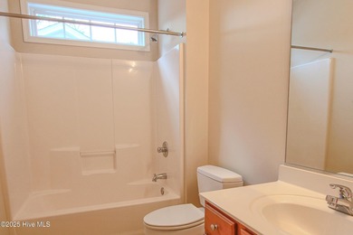 Welcome to your dream home in Cobblestone Village, nestled in on Sea Trail Golf Resort in North Carolina - for sale on GolfHomes.com, golf home, golf lot