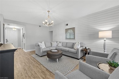 Beautifully updated first-floor coach home featuring luxury on Pelican Sound Golf and River Club in Florida - for sale on GolfHomes.com, golf home, golf lot