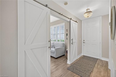 Beautifully updated first-floor coach home featuring luxury on Pelican Sound Golf and River Club in Florida - for sale on GolfHomes.com, golf home, golf lot