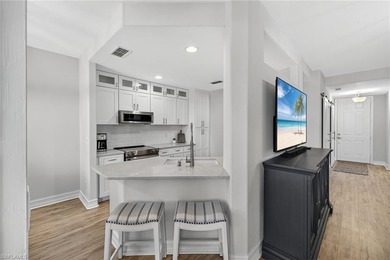 Beautifully updated first-floor coach home featuring luxury on Pelican Sound Golf and River Club in Florida - for sale on GolfHomes.com, golf home, golf lot