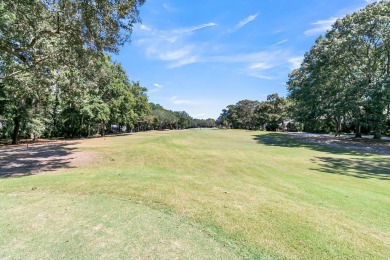 Escape to your serene golf course view in this on Charleston National Golf Club in South Carolina - for sale on GolfHomes.com, golf home, golf lot