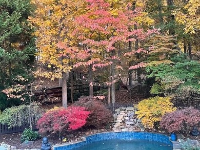 Fall is in the air, and this home frames the season on Woodmont Golf and Country Club in Georgia - for sale on GolfHomes.com, golf home, golf lot