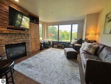 Fully furnished corner unit at the Lodge at Cedar River Village on Cedar River Golf Course in Michigan - for sale on GolfHomes.com, golf home, golf lot