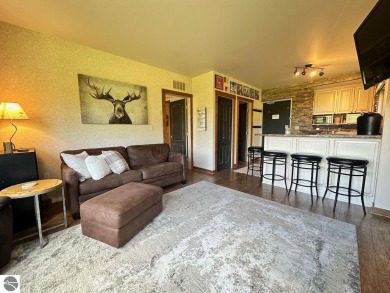 Fully furnished corner unit at the Lodge at Cedar River Village on Cedar River Golf Course in Michigan - for sale on GolfHomes.com, golf home, golf lot
