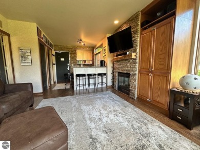 Fully furnished corner unit at the Lodge at Cedar River Village on Cedar River Golf Course in Michigan - for sale on GolfHomes.com, golf home, golf lot