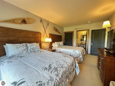 Fully furnished corner unit at the Lodge at Cedar River Village on Cedar River Golf Course in Michigan - for sale on GolfHomes.com, golf home, golf lot