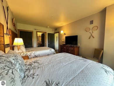 Fully furnished corner unit at the Lodge at Cedar River Village on Cedar River Golf Course in Michigan - for sale on GolfHomes.com, golf home, golf lot