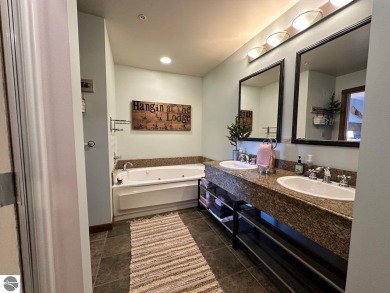 Fully furnished corner unit at the Lodge at Cedar River Village on Cedar River Golf Course in Michigan - for sale on GolfHomes.com, golf home, golf lot