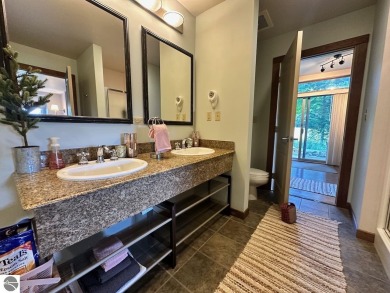 Fully furnished corner unit at the Lodge at Cedar River Village on Cedar River Golf Course in Michigan - for sale on GolfHomes.com, golf home, golf lot
