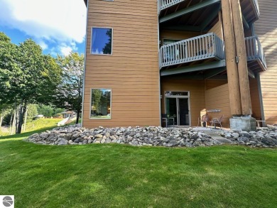 Fully furnished corner unit at the Lodge at Cedar River Village on Cedar River Golf Course in Michigan - for sale on GolfHomes.com, golf home, golf lot