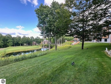 Fully furnished corner unit at the Lodge at Cedar River Village on Cedar River Golf Course in Michigan - for sale on GolfHomes.com, golf home, golf lot