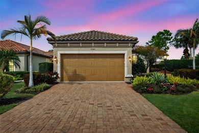 MAINTENANCE-FREE ELEGANCE WITH POND VIEWS! Welcome to your on Esplanade Golf and Country at Lakewood Ranch in Florida - for sale on GolfHomes.com, golf home, golf lot