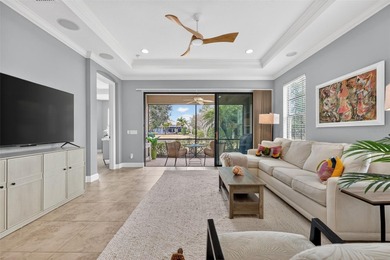 MAINTENANCE-FREE ELEGANCE WITH POND VIEWS! Welcome to your on Esplanade Golf and Country at Lakewood Ranch in Florida - for sale on GolfHomes.com, golf home, golf lot