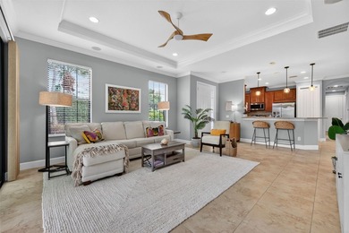 MAINTENANCE-FREE ELEGANCE WITH POND VIEWS! Welcome to your on Esplanade Golf and Country at Lakewood Ranch in Florida - for sale on GolfHomes.com, golf home, golf lot