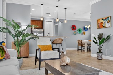 MAINTENANCE-FREE ELEGANCE WITH POND VIEWS! Welcome to your on Esplanade Golf and Country at Lakewood Ranch in Florida - for sale on GolfHomes.com, golf home, golf lot