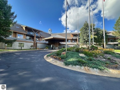 Fully furnished corner unit at the Lodge at Cedar River Village on Cedar River Golf Course in Michigan - for sale on GolfHomes.com, golf home, golf lot