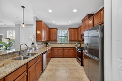 MAINTENANCE-FREE ELEGANCE WITH POND VIEWS! Welcome to your on Esplanade Golf and Country at Lakewood Ranch in Florida - for sale on GolfHomes.com, golf home, golf lot