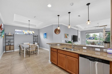 MAINTENANCE-FREE ELEGANCE WITH POND VIEWS! Welcome to your on Esplanade Golf and Country at Lakewood Ranch in Florida - for sale on GolfHomes.com, golf home, golf lot