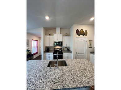 This MOVE- IN READY, LIKE NEW, WATERFRONT home, built in 2022 is on Grand Reserve Golf Course in Florida - for sale on GolfHomes.com, golf home, golf lot