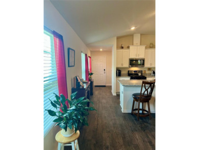 This MOVE- IN READY, LIKE NEW, WATERFRONT home, built in 2022 is on Grand Reserve Golf Course in Florida - for sale on GolfHomes.com, golf home, golf lot