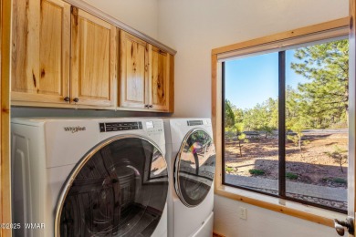 Beautiful corner lot cabin in Show Low's Torreon Golf community on Torreon Golf Club in Arizona - for sale on GolfHomes.com, golf home, golf lot