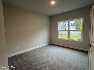 Ready Now! This beautiful new home in Palmetto Creek has a pond on Lennon Hills Golf Course in North Carolina - for sale on GolfHomes.com, golf home, golf lot