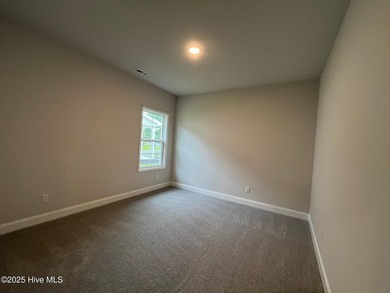 Ready Now! This beautiful new home in Palmetto Creek has a pond on Lennon Hills Golf Course in North Carolina - for sale on GolfHomes.com, golf home, golf lot