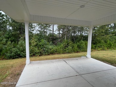 Ready Now! This beautiful new home in Palmetto Creek has a pond on Lennon Hills Golf Course in North Carolina - for sale on GolfHomes.com, golf home, golf lot