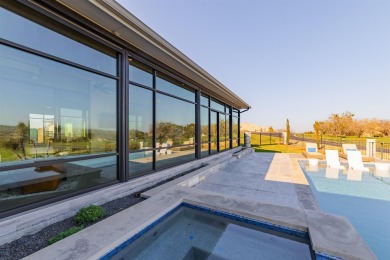 Welcome to this stunning contemporary home nestled on over 1 on Ram Rock Golf Course in Texas - for sale on GolfHomes.com, golf home, golf lot