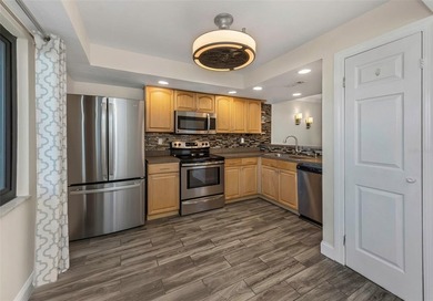 Move right into this beautifully updated first-floor condo on East Lake Woodlands Country Club in Florida - for sale on GolfHomes.com, golf home, golf lot