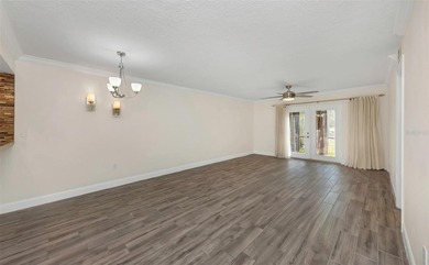 Move right into this beautifully updated first-floor condo on East Lake Woodlands Country Club in Florida - for sale on GolfHomes.com, golf home, golf lot