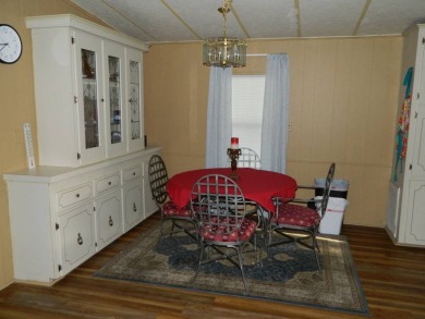 1985 Ventura 26x48 has been updated with double pane windows on Grasslands Golf and Country Club in Florida - for sale on GolfHomes.com, golf home, golf lot