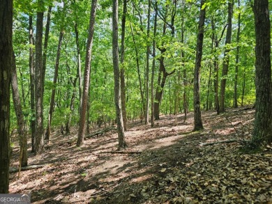 Nestled within the serene and exclusive Big Canoe community in on Big Canoe Golf Club - Cherokee in Georgia - for sale on GolfHomes.com, golf home, golf lot
