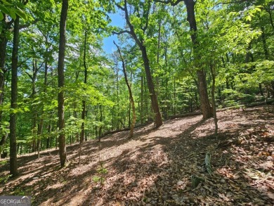 Nestled within the serene and exclusive Big Canoe community in on Big Canoe Golf Club - Cherokee in Georgia - for sale on GolfHomes.com, golf home, golf lot