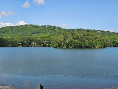 Nestled within the serene and exclusive Big Canoe community in on Big Canoe Golf Club - Cherokee in Georgia - for sale on GolfHomes.com, golf home, golf lot