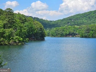 Nestled within the serene and exclusive Big Canoe community in on Big Canoe Golf Club - Cherokee in Georgia - for sale on GolfHomes.com, golf home, golf lot