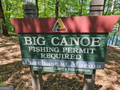 Nestled within the serene and exclusive Big Canoe community in on Big Canoe Golf Club - Cherokee in Georgia - for sale on GolfHomes.com, golf home, golf lot